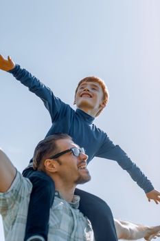 happy father and son playing together.photo with copy space