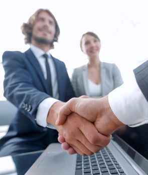Two confidence businessman shaking hands close-up view of hands,