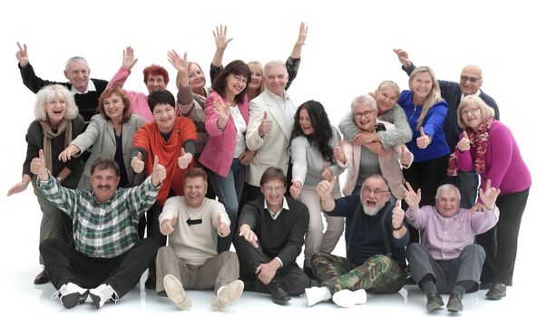 Group of happy elderly people standing and sitting isolated over a white