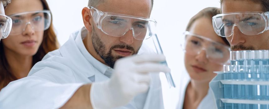 closeup of a group of scientists and pharmacists in the laboratory.the concept of the study.