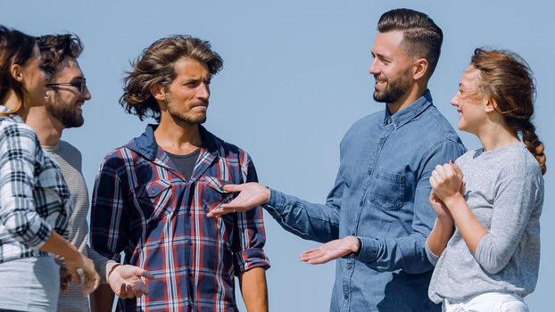 group of students talking while standing outdoors.photo with copy space