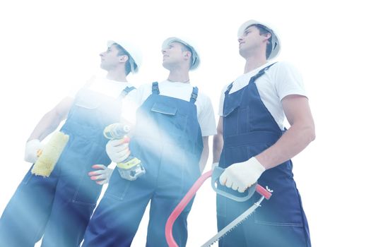 Group of builders in overalls isolated on white background