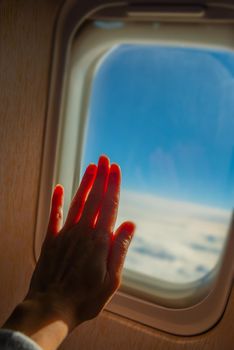 View from a jet plane window high on the blue skies. Beautiful landscape.