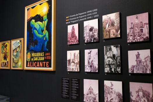 Alicante, Spain- May 12, 2022: Vintage pictures of Belleas del Foc women in traditional costumes exhibited in The Hogueras Museum of Alicante