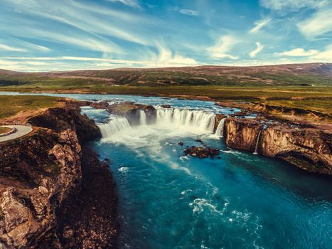 Aerial view landscape of the Godafoss famous waterfall in Iceland. The breathtaking landscape of Godafoss waterfall attracts tourist to visit the Northeastern Region of Iceland.