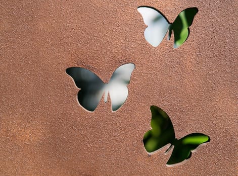 Butterfly metal work. Cast iron plate with artistic butterly shape