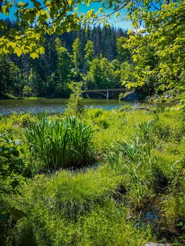 Long steel hanging footbridge over Modre lake