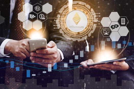 Ethereum and cryptocurrency investing concept - Businessman using mobile phone application to trade Ethereum ETH with another trader in modern graphic interface. Blockchain and financial technology.