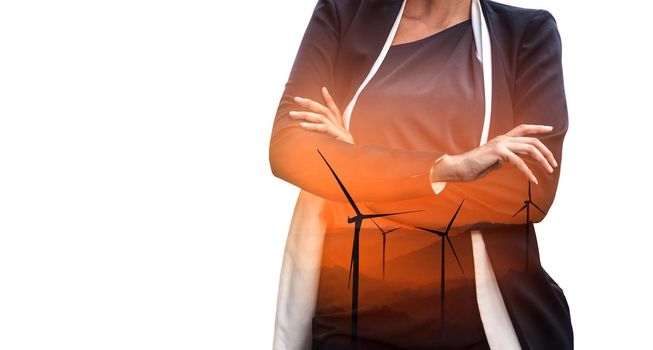 Double exposure graphic of business people working over wind turbine farm and green renewable energy worker interface. Concept of sustainability development by alternative energy.