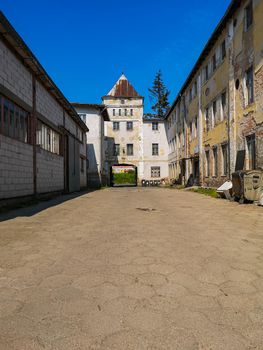 Urban exploration of square with few old buildings