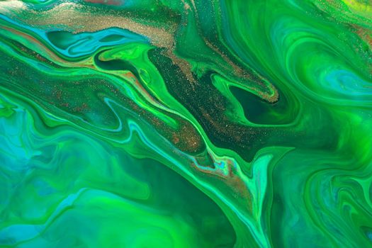 Green marble abstract acrylic background. Marbly artwork texture. Agate ripple pattern with gold powder