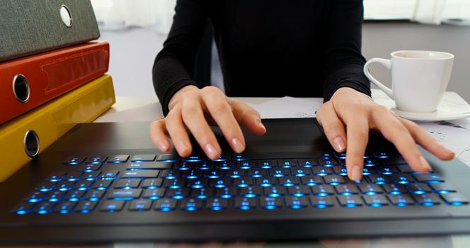 Business woman user worker using typing on laptop keyboard sit at office desk. Working online with pc software apps technology concept. Close up.