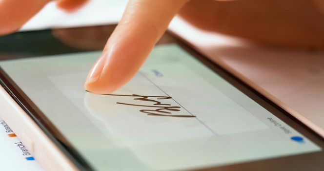 Sign document of deal on digital gadget. Digital signature on smartphone screen with woman hand. Close up.