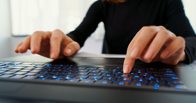 Woman typing on desktop computer keyboard for searching information, marketing research, online communication support, reports. Working online, technology, office work day.