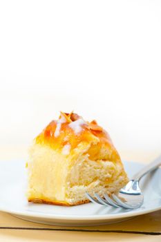 fresh home baked sweet bread donut cake with almonds and icing sugar on top