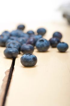 fresh blueberry on white rustic wood table macro