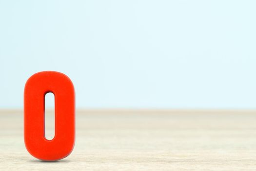 Shot of a number zero made of red plastic on table with copy space