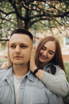 loving couple walking in ukrainian park and city