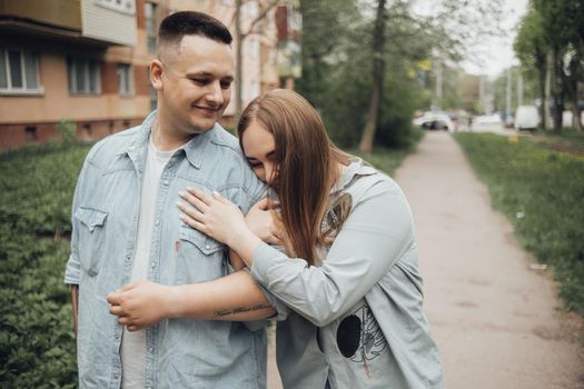 loving couple walking in ukrainian park and city