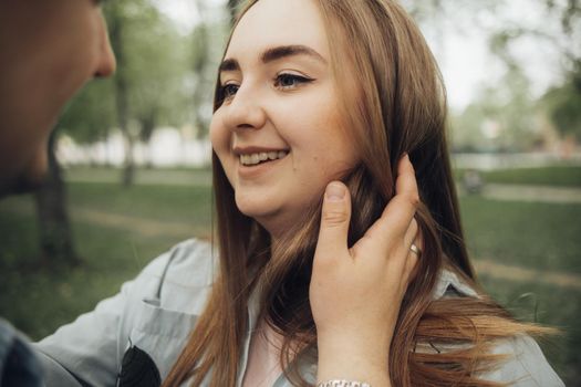 loving couple walking in ukrainian park and city