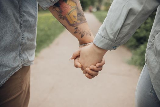 loving couple walking in ukrainian park and city