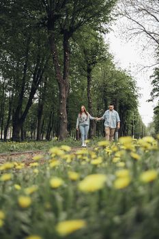 loving couple walking in ukrainian park and city