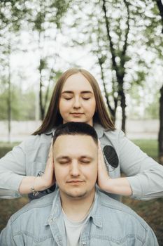 loving couple walking in ukrainian park and city