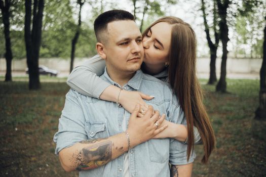 loving couple walking in ukrainian park and city