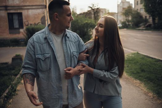 loving couple walking in ukrainian park and city