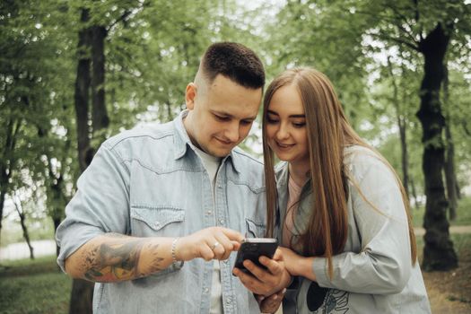 loving couple walking in ukrainian park and city