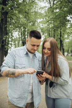 loving couple walking in ukrainian park and city