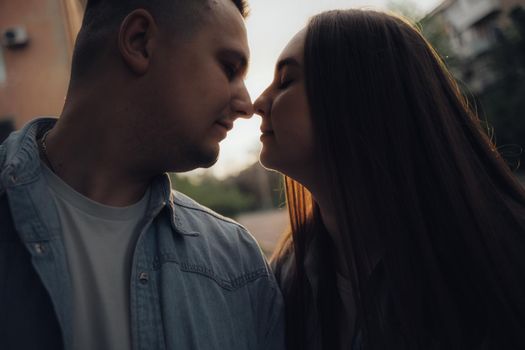 loving couple walking in ukrainian park and city