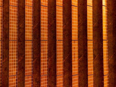 Aerial top view of a solar panels power plant. Photovoltaic solar panels at sunrise and sunset in countryside from above. Modern technology, climate care, earth saving, renewable energy concept