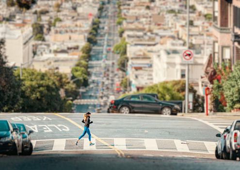 San Francisco, United States of America - October 30, 2016: Woman running in streets of San Francisco. California, Unites States of America.