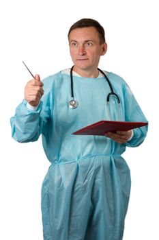 Medical doctor dressed in a medical gown with stethoscope holding a notebook and pointing with pen. White isolated background