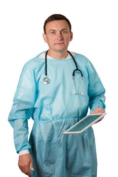 Medical doctor dressed in a medical gown with stethoscope holding a tablet. White isolated background