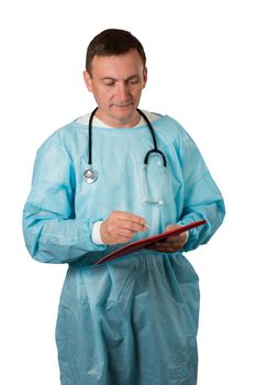 Medical doctor dressed in a medical gown with stethoscope holding a pen and writing in a notebook. White isolated background