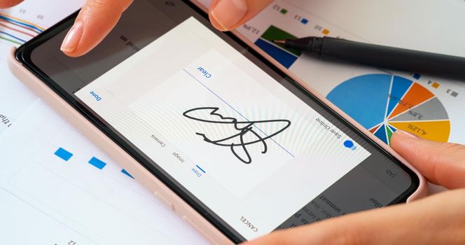 Digital signature in modern business office. Close up business office workplace.