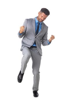 Happy business man celebrate victory holding fists full length isolated on white background