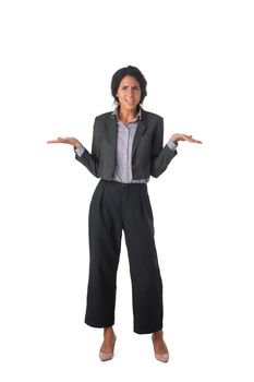 Puzzled woman wearing black business suit holding hands in air in confusion with the face expression I do not know, so what isolated on a white background.
