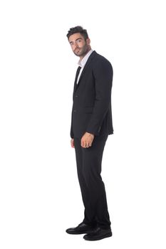 Full body of young handsome business man in black suit isolated on white background