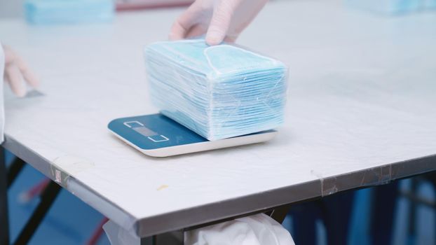 Face mask production line in modern factory . Concept of covid-19 coronavirus 2019 provention .