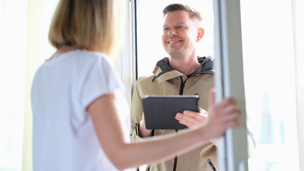 Smiling man conducting social survey in apartment. Population census concept