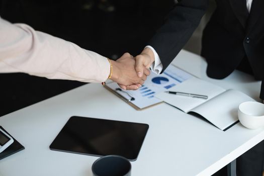 Business partnership meeting concept. Image business women handshake. Successful business people handshaking after good deal. Group support concept