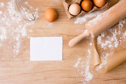 rolling pin with eggs rack paper flour