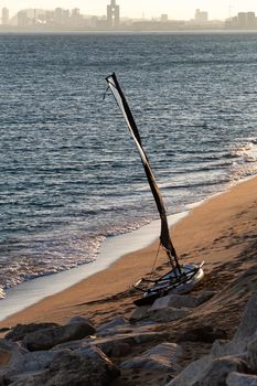 Windsurf board on the sunset at the beach of mediterranean sea, Maresme, El Masnou, Catalonia, Spain.