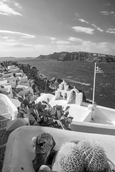 Oia town cityscape at Santorini island in Greece. Aegean sea in black and white