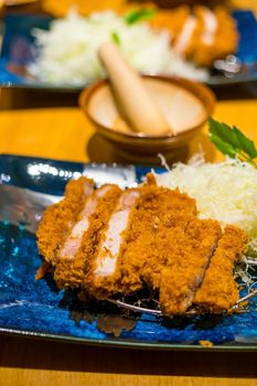 Japanese Tonkatsu (deep-fried pork cutlet) full set. It served with shredded cabbage.