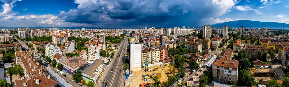 Amazing aerial panorama from a drone of city Sofia with stormy clouds, Bulgaria