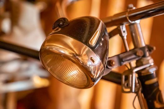 The front lights of an old bicycle. Vintage view
